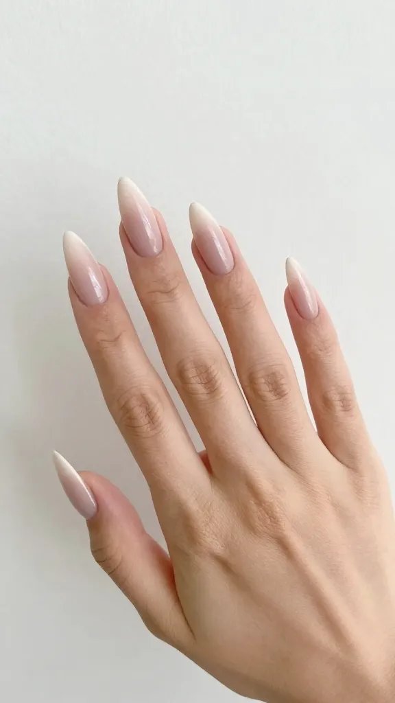 Manicured hand, lengthening stiletto nails, clean background