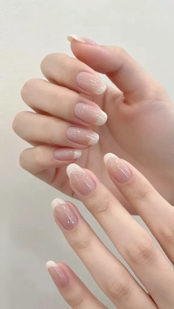 Elegant hand, almond nails, soft focus.