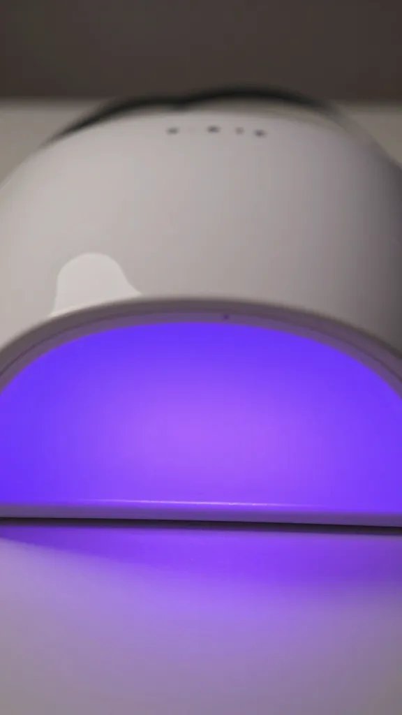 Closeup, UV nail lamp light.